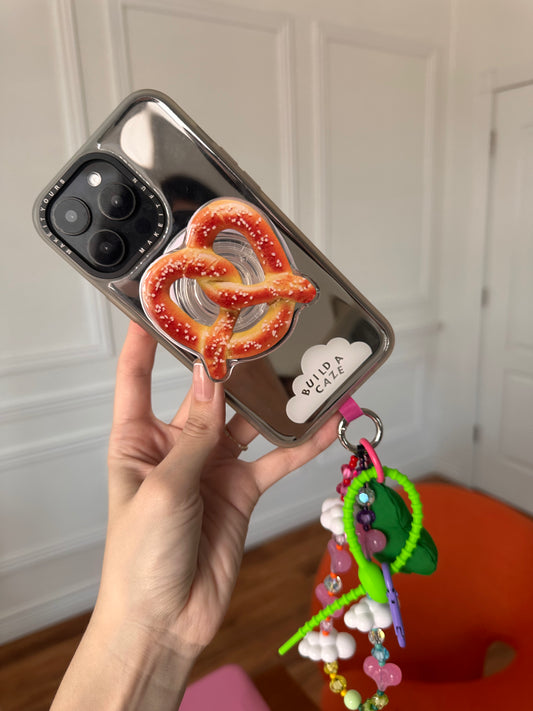 Sujetador Pop Grippy de pretzel trenzado, accesorio magnético para celular, agarre seguro para móvil.