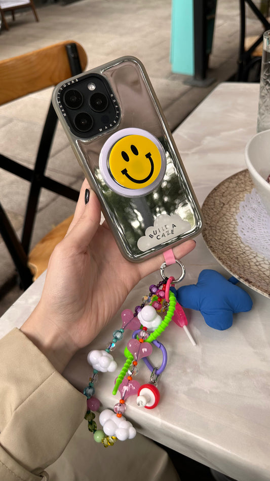 Sujetador Pop Grippy de cara sonriente para celular, accesorio móvil redondo, soporte para teléfono magnético, agarre expandible para smartphone.