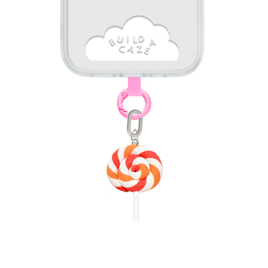 Accesorio para celular L Orange Swirl Charmie de Build a Caze, colgante en forma de paleta con diseño de espiral en color naranja vibrante para decoración y personalización de smartphones.