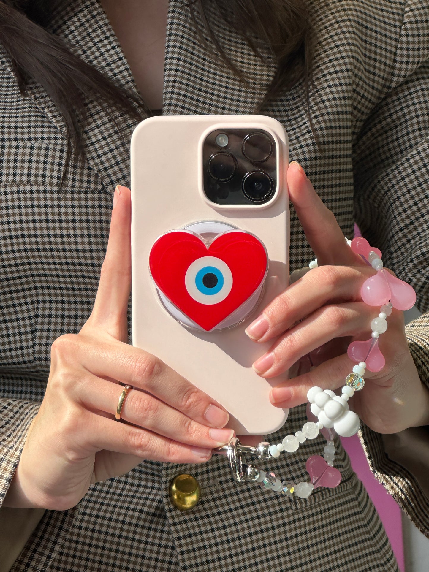 Soporte Pop Grippy de corazón protector, agarre seguro para celular, accesorio móvil.