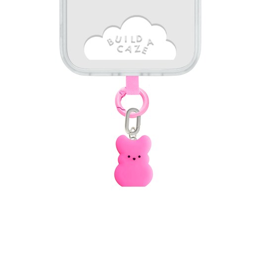 dije en forma de conejito de azúcar rosa, estilo peeps. dije build a caze